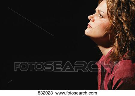 Stock Image - Woman deep in thought. Fotosearch