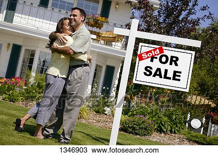 Couple celebrates buying new home View Large Photo Image Stock Image - Couple celebrates buying new home. Fotosearch