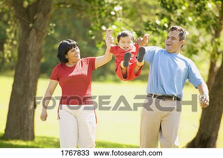 Stock Image - Family goes for a walk. Fotosearch