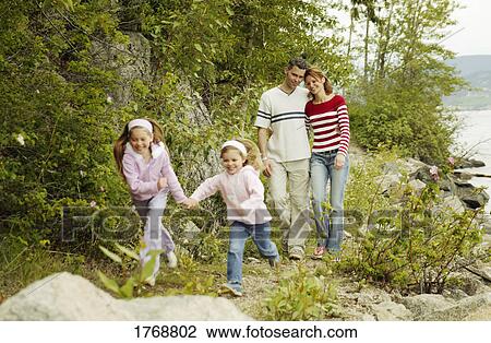 Family goes for a walk View Large Photo Image Stock Image - Family goes for a walk. Fotosearch