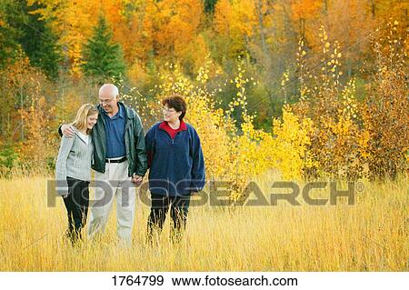 Family goes for a walk View Large Photo Image Stock Photo - Family goes for a walk. Fotosearch
