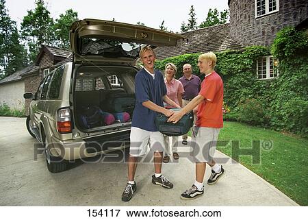 Stock Photo - Family packing for camping trip. Fotosearch