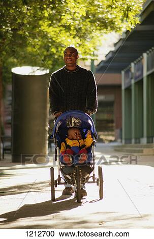 Father and child on a walk View Large Photo Image Stock Image - Father and child on a walk. Fotosearch