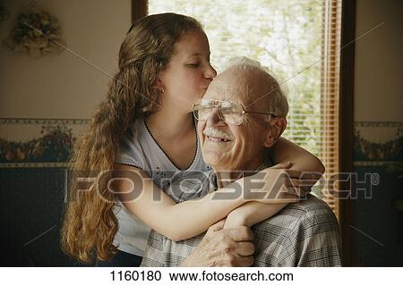 Stock Image - Girl and senior together. Fotosearch