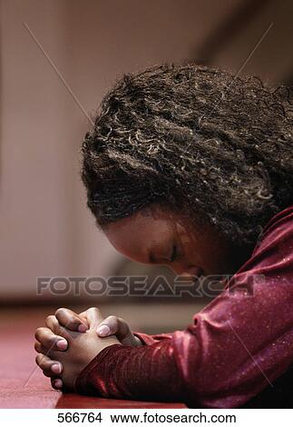 Girl praying View Large Photo Image Picture - Girl praying. Fotosearch