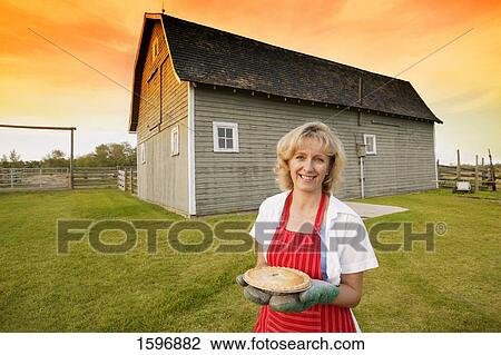 Stock Image - Housewife on the farm. Fotosearch