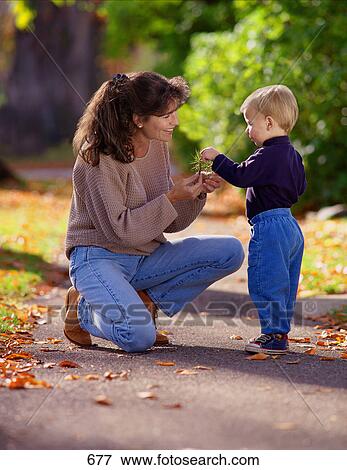 Stock Photo - Mother and child in a park.. Fotosearch