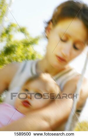 Stock Image - Mother and child on a swing. Fotosearch
