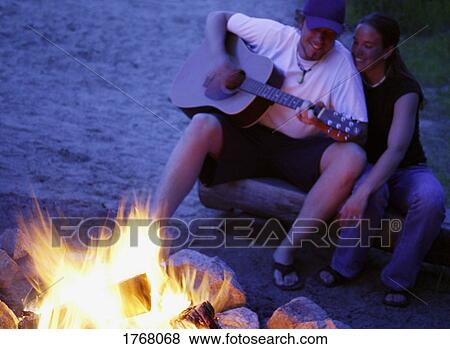 Songs by campfire View Large Photo Image Stock Photo - Songs by campfire. Fotosearch