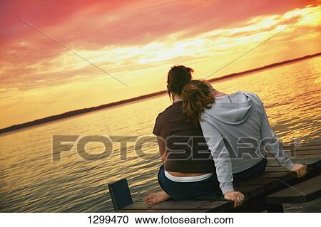 Two girls enjoy the view View Large Photo Image Stock Image - Two girls enjoy the view. Fotosearch