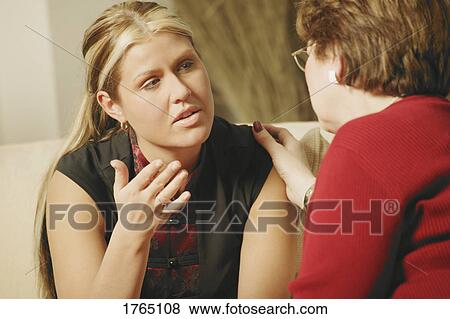 Stock Photo - Woman is comforted. Fotosearch