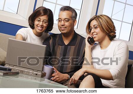 Stock Photography - Working on a lap top. Fotosearch