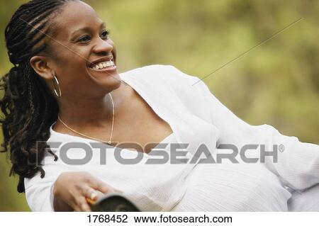 Stock Image - Young pregnant woman. Fotosearch