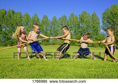 A group of children play tug of war View Large Photo Image Stock Photography - A group of children play tug of war. Fotosearch