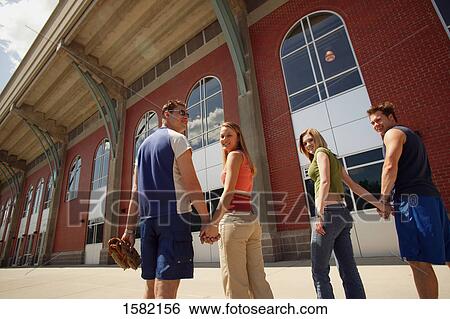 Couples go to baseball game View Large Photo Image Stock Photograph - Couples go to baseball game. Fotosearch