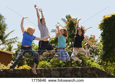 Group of teens jumping View Large Photo Image Stock Photograph - Group of teens jumping. Fotosearch