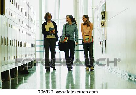 Students walk down hallway View Large Photo Image Stock Photo - Students walk down hallway. Fotosearch