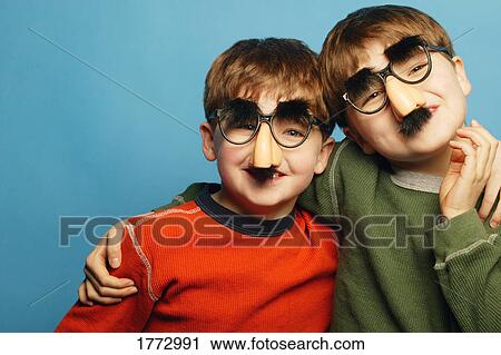 Two boys wearing funny masks View Large Photo Image Stock Image - Two boys wearing funny masks. Fotosearch