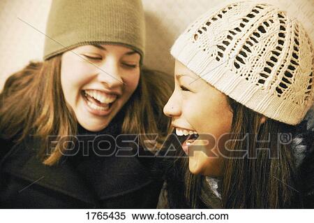 Stock Photography - Two girls with toques. Fotosearch
