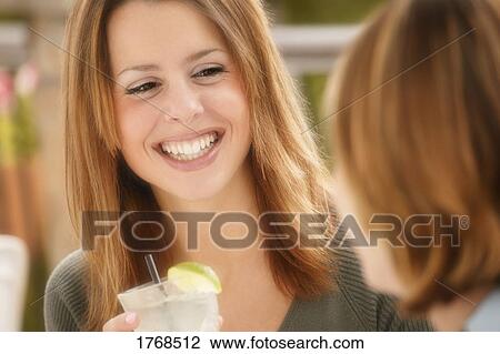 Young woman with drink View Large Photo Image Stock Image - Young woman with drink. Fotosearch