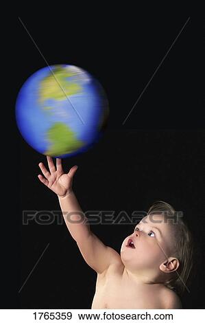 A child with the world at his fingertips View Large Photo Image Stock Photo - A child with the world at his fingertips. Fotosearch