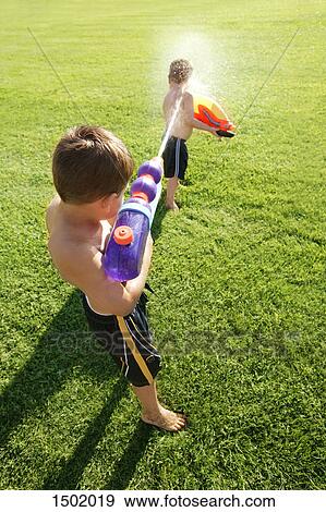 A water fight View Large Photo Image Stock Photo - A water fight. Fotosearch