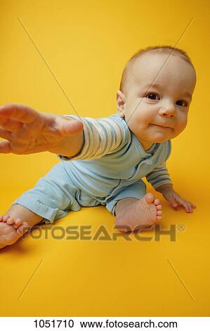 Baby reaches out View Large Photo Image Stock Image - Baby reaches out. Fotosearch