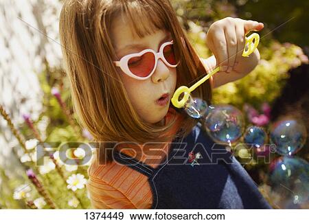 Stock Photo - Blowing bubbles. Fotosearch