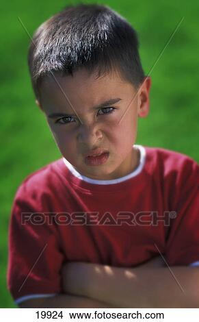 Picture - Boy frowns. Fotosearch