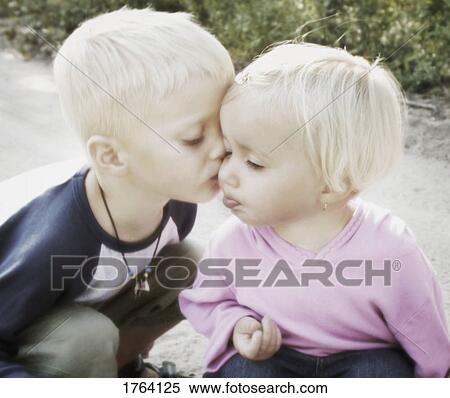 Boy kisses girl View Large Photo Image Stock Photography - Boy kisses girl. Fotosearch