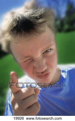 Stock Photograph - Boy with attitude. Fotosearch