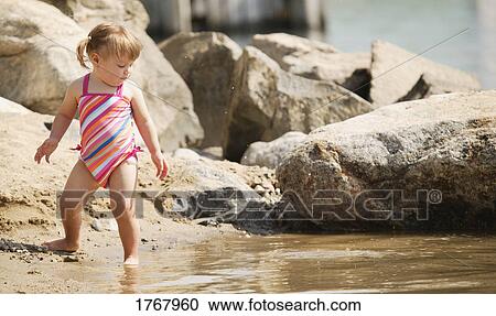 Child at the beach View Large Photo Image Stock Image - Child at the beach. Fotosearch