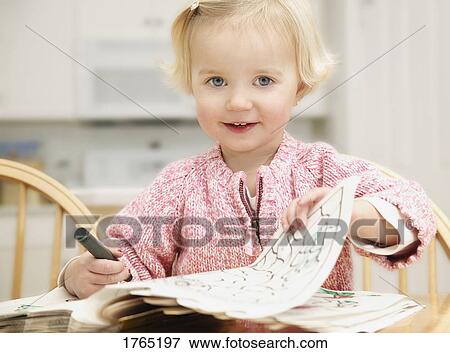 Child colors in book View Large Photo Image Stock Photo - Child colors in book. Fotosearch