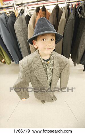 Stock Photo - Child plays dress up. Fotosearch