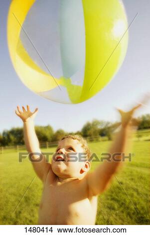 Picture - Child plays with a ball. Fotosearch