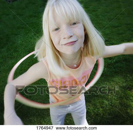 Child plays with hoop View Large Photo Image Stock Photo - Child plays with hoop. Fotosearch