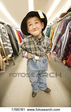 Child tries on clothes View Large Photo Image Stock Image - Child tries on clothes. Fotosearch