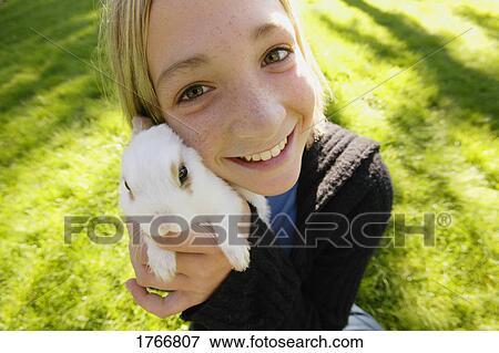 Child with a pet View Large Photo Image Stock Photo - Child with a pet. Fotosearch