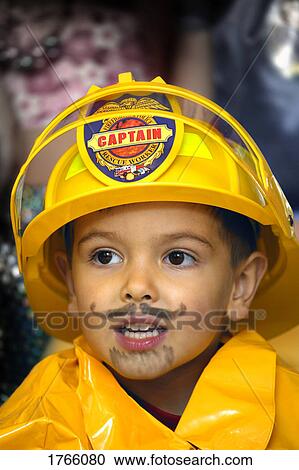 Little boy dressed like a fireman at Halloween View Large Photo Image Stock Image - Little boy dressed like a fireman at Halloween. Fotosearch