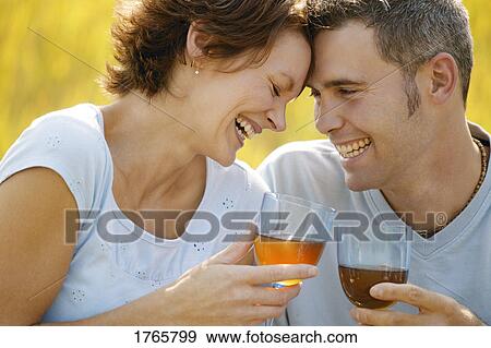 Stock Photo - Couple enjoy a drink. Fotosearch