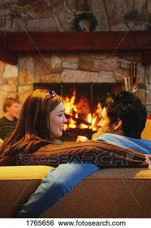 Couple in front of a fireplace Stock Photograph | 1765656 | Fotosearch