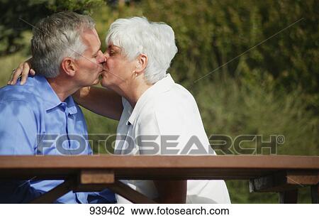 Stock Image - Couple share a kiss. Fotosearch