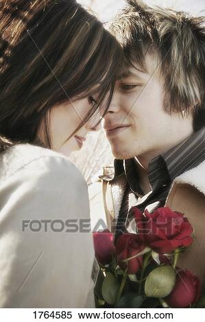 Couple with roses View Large Photo Image Stock Photography - Couple with roses. Fotosearch