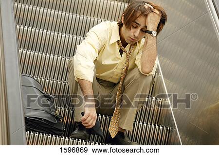 Asleep on the escalator View Large Photo Image Stock Photo - Asleep on the escalator. Fotosearch
