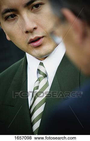Businessman listens View Large Photo Image Stock Photo - Businessman listens. Fotosearch