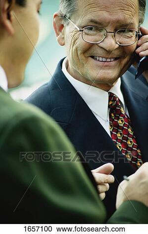 Stock Image - Businessman smiles. Fotosearch