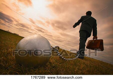 Businessman with ball and chain View Large Photo Image Stock Photo - Businessman with ball and chain. Fotosearch
