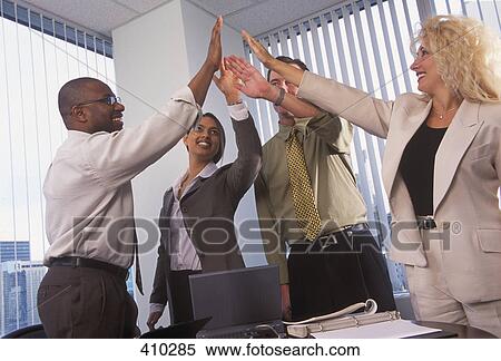 Stock Photography - Businesspeople high five. Fotosearch