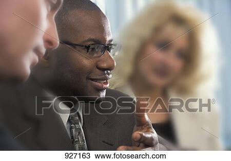 Man in a meeting View Large Photo Image Stock Image - Man in a meeting. Fotosearch