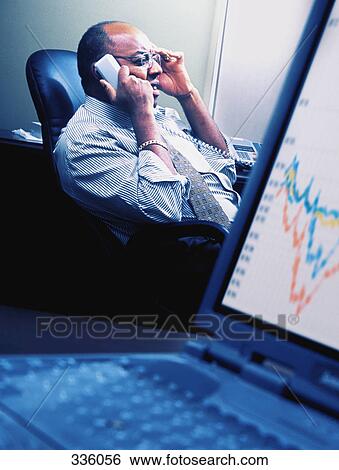 Man speaking on telephone View Large Photo Image Stock Photograph - Man speaking on telephone. Fotosearch